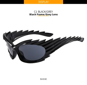 Detail view of the black frame grey lens sunglasses with unique layered wing side design