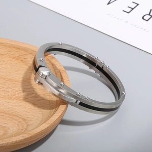 Industrial style silver titanium steel bracelet with carbon fiber and rivet details