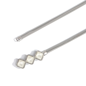 Detail of silver elastic waist chain with three sparkling white gemstone buckle elements