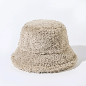 Detailed view of the soft beige plush fabric texture on this warm winter bucket hat