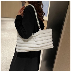 White faux fur baguette bag with luxury pearl bead shoulder strap and golden metal clasps