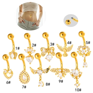 Collection of ten gold-plated belly rings with micro-pave cubic zirconia wing and heart designs