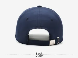 Detail view of the navy baseball cap featuring an adjustable silver metal buckle at the back