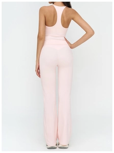 Rear view of pink racerback tank top and high-waisted flared yoga pants on model