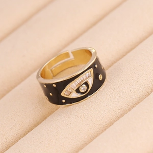 Macro shot of evil eye heart ring with colorful zircon and black enamel in a jewelry box