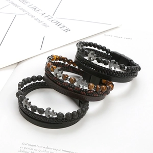 Stacked multi-layer leather bracelets with tiger eye beads and metal anchor pendant