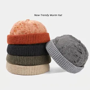 Distressed knit docker hats in five colors featuring vintage ripped details and ribbed cuffs
