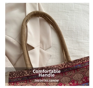 Close-up of woven handle and vintage pattern on linen tote bag details