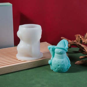 Detail of Christmas snowman silicone mold with 3D finished aromatherapy candle and festive decor
