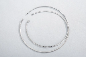 Detailed view of silver stainless steel omega snake chain necklaces with lobster clasps