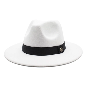Detail view of white wool fedora with black ribbon band and golden metal M letter charm