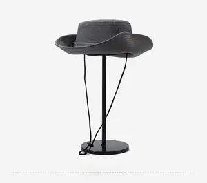 Detail view of adjustable drawstring and side breathable mesh on deep gray sun hat