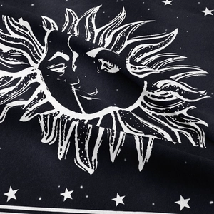 Close-up of bohemian sun and moon tapestry with detailed knit texture and star patterns