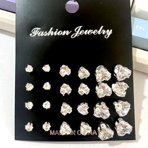 Set of 12 pairs of heart-shaped crystal stud earrings with silver-tone prong settings