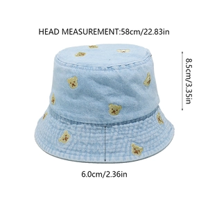 Blue denim bucket hat with bear embroidery showing precise size dimensions and measurements