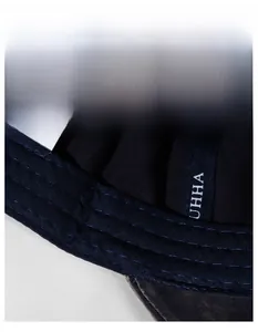 Macro view of widened sweatband inside denim baseball cap with breathable knit fabric