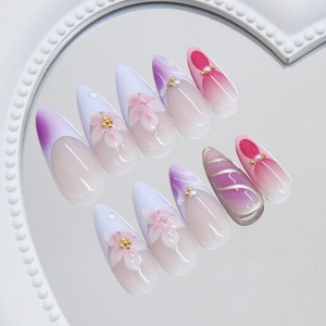 Pastel lavender stiletto press-on nails with 3D floral art and pearl accents