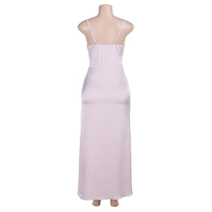 Detail view of pink satin slip dress featuring cross back straps and open back design