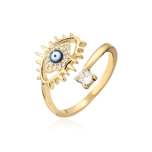 Detail of gold evil eye open ring featuring blue enamel and sparkling zircon accents