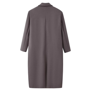 Detail of long wool coat in dark grey with thick fabric and sharp tailored back cut