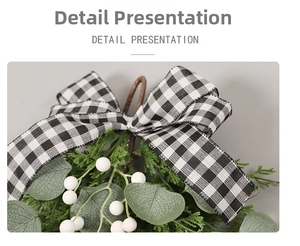 Detail of Christmas eucalyptus teardrop swag with buffalo plaid bow and white berries