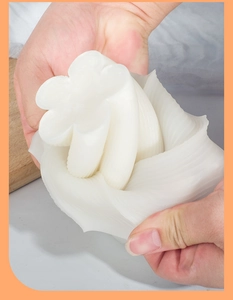 Detailed view of flexible white floral silicone mold showing high elasticity and soft texture