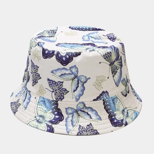 Close-up of butterfly print detail and stitching on cream cotton bucket hat