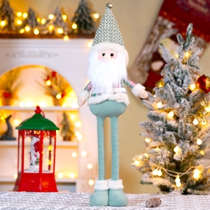 Detail of Christmas plush gnome with a long white beard and a green checkered pointed hat