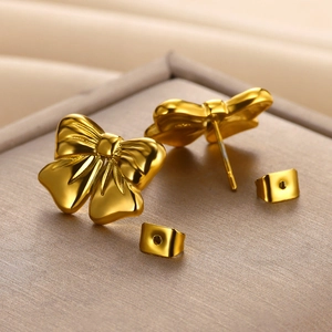 Elegant 18K gold-plated stainless steel bow earrings with a textured polished finish