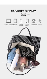 Detail showing the large capacity of the black and white checkered tote bag with silver studs