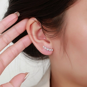 Minimalist sterling silver curved crawler earrings with sparkling cubic zirconia stones