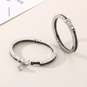 Punk style unisex stainless steel hinge bracelet with black carbon fiber and rivet details