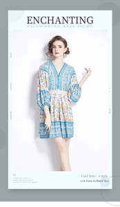 Detail of V-neck printed dress with ethnic floral patterns and white buckle waist belt