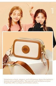 Detail of cream and brown crossbody bag with wide logo strap on geometric props