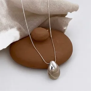 Minimalist silver waterdrop pendant necklace with polished snake chain for women style