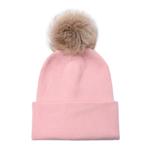 Detailed texture of pink ribbed knit beanie with a detachable fluffy raccoon fur pom-pom