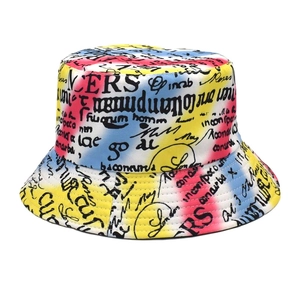 Close-up of vibrant graffiti bucket hat featuring colorful abstract patterns and artistic text