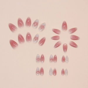 Almond press-on nails featuring pink gradient and 3D cherry blossom floral art design