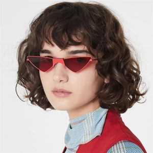Fashionable red cat eye sunglasses with triangular frame on model with white background