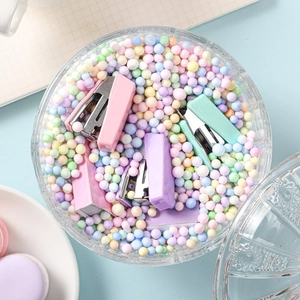 Mini macaron pastel stapler set in a decorative glass bowl with colorful foam balls