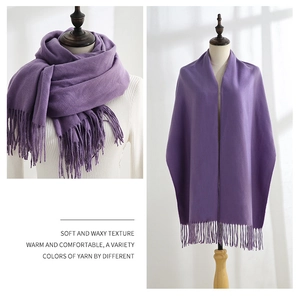 Detail of soft purple faux cashmere scarf showing delicate tassels and warm knit texture