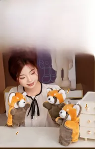 Detail of red panda plush hand puppet showing soft texture and expressive facial features