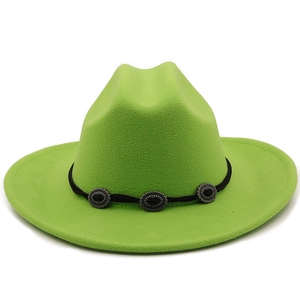 Close-up of neon green wool felt cowboy hat with black band and vintage silver buckles