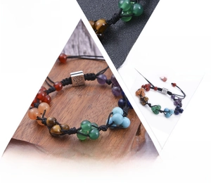 Detailed view of handmade chakra stone bracelet with woven rope and natural crystals
