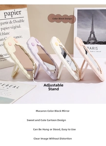 Detail of macaron-colored makeup mirrors with wave edges and adjustable folding stands