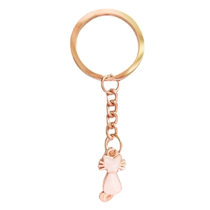 Detail shot of the rose gold metal keyring with a pink cat pendant on white background