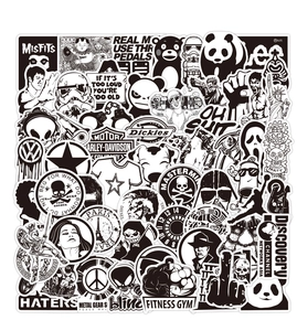 Close-up of black and white punk graffiti vinyl stickers featuring various mixed designs
