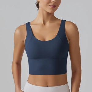 Detail of navy blue V-back sports bra with wide straps and high elastic support fabric