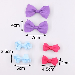 Size comparison chart for ribbed grosgrain bow hair clips in purple, blue and pink