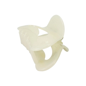 Macro detail of crescent moon shaped cream acetate hair claw clip with glossy finish